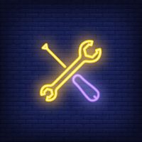 Crossed screwdriver and wrench on brick background. Neon style illustration. Custom motorcycle, repair shop, mechanic. Workshop banner. For service, engineering, maintenance concept - 5VIER